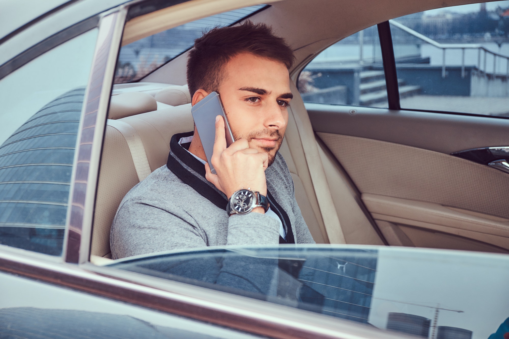 a handsome businessman in luxury car 1